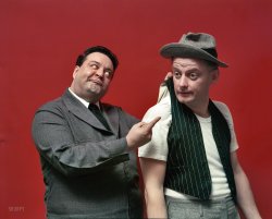 April 1955. "Entertainers Jackie Gleason and Art Carney, in costume, posed as their 'Honeymooners' characters Ralph Kramden and Ed Norton." Color transparency from unpublished photos by Arthur Rothstein and Douglas Jones for the Look magazine assignment "Gleason's Pal Carney." View full size.