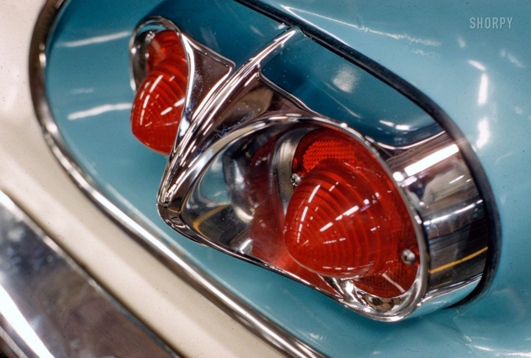 October 1957. "Taillight of 1958 Chevrolet." One of the lower-end Chevys, which had duplex taillights, as opposed to the triple-light tail-plus-backup arrangement on the deluxe models. Photo by Phillip Harrington for the Look magazine assignment "GM's 50 Years of Men, Money and Motors." View full size.