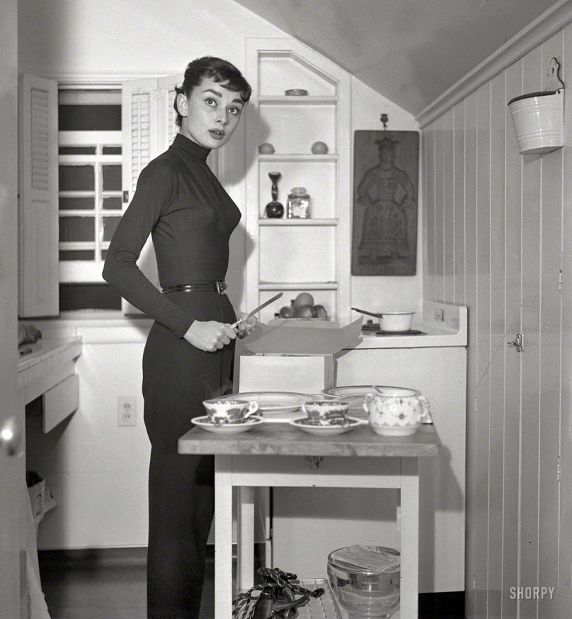 &nbsp; &nbsp; &nbsp; &nbsp; Why yes, we'd love some!
Circa 1953, "Actress Audrey Hepburn at home preparing and serving coffee and cake." From photos by Earl Theisen for Look magazine. View full size.
