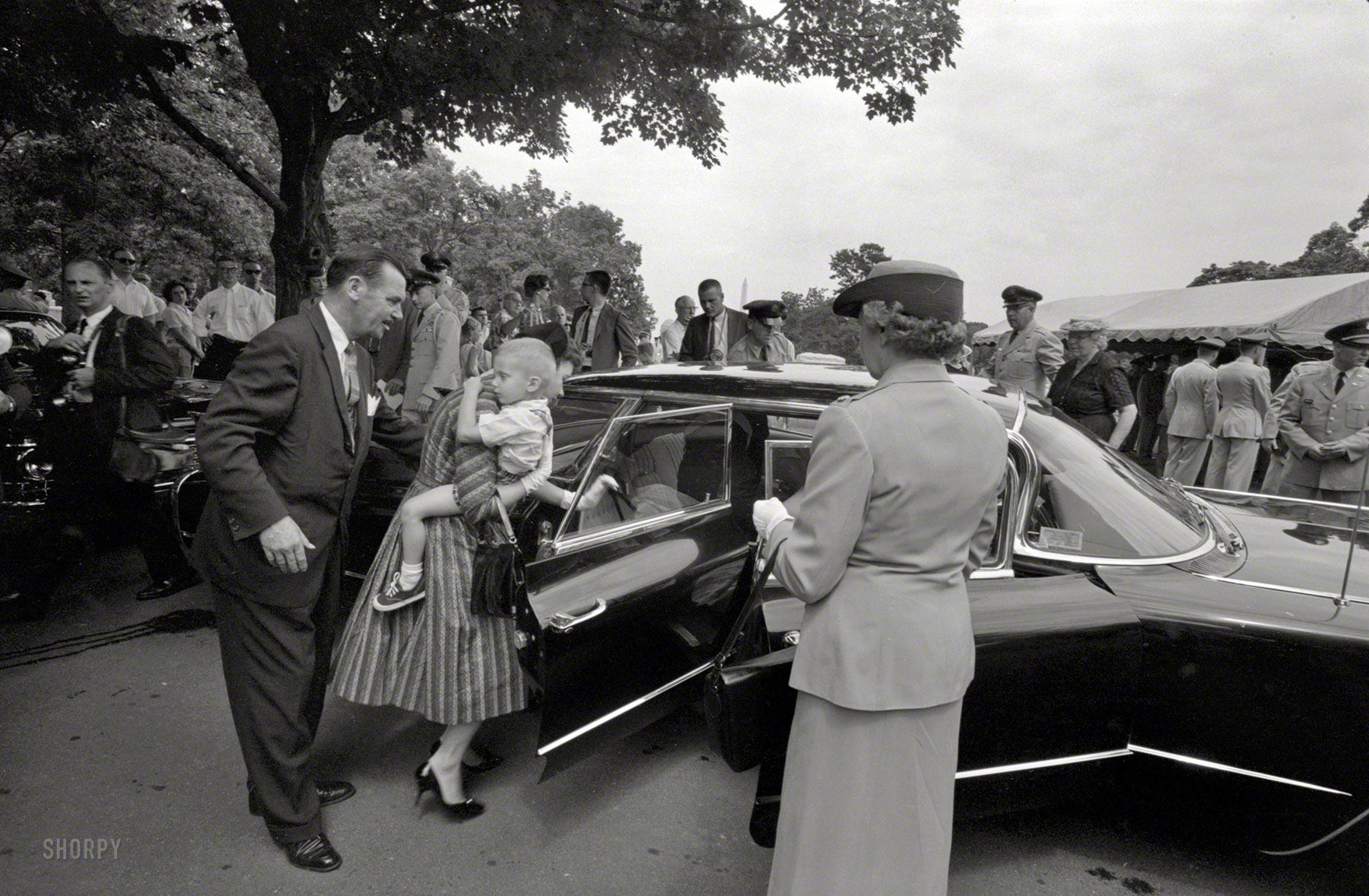 August 4, 1960. "Family and mourners at the Arlington National Cemetery burial of Willard G. Palm, RB-47 reconnaissance airplane pilot shot down by the Russians." Photo by John T. Bledsoe, U.S. News & World Report. View full size.