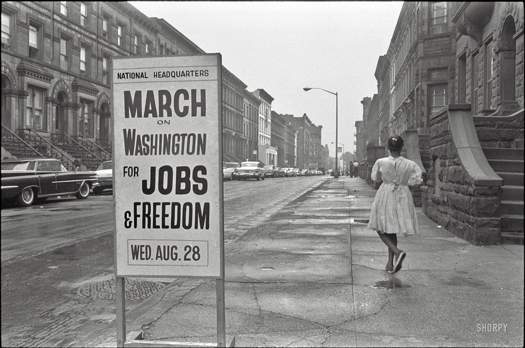 August 1963. "New York. Sidewalk sign outside the March on Washington headquarters building, 170 W. 130th Street." Photo by Werner Wolff for U.S. News & World Report. View full size.