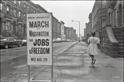 August 1963. "New York. Sidewalk sign outside the March on Washington headquarters building, 170 W. 130th Street." Photo by Werner Wolff for U.S. News &amp; World Report. View full size.
How Can?How can marching around and making speeches create jobs?
[By leading to passage of the Civil Rights Act of 1964, specifically Title VII. - Dave]
Memorable dateOn that date, the 18-year-old girl (who was to become my wife 15 years later) headed from NYC to Washington with her grandfather, and had the incredible experience of hearing Martin Luther King, Jr., give his "I Have a Dream" speech.  In her memory (she died in 1984), I will be at the Lincoln Memorial this Wednesday.
Calendar sync!90 years anniversary, and Wednesday is again 8/28!
[Um... next Wednesday will be the 50th anniversary of the march. -tterrace]
Uh - typo?!? Or short on coffee...
Why Arbor Day is a terrific ideaBleak and uninviting in 1963, this block of West 130th looks immeasurably nicer today even though most of the buildings are largely unchanged on the outside.  The big difference is that the formerly treeless block is now lined with sidewalk trees, a simple change that greatly softens 1963's stark appearance.  
No. 170 is still there, as are the buildings just past it with the interesting brownstone stoops.  Several of the buildings across the street were torn down and there's now a paved parking area on their site.
View Larger Map
Bill Landau: thanks for your posting.Curious how a scant 5 lines can indicate a whole slice of other people's lives.  
Sorry for the loss of your wife: too soon, she was only 3 years older than me and it's now almost 30 years since she passed.  I will be thinking of this posting on Wednesday.
(NYC)