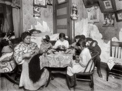 New York. December 1911. "5 p.m. Mrs. Mary Mauro, 309 E. 110th St., 2nd floor. Family works on feathers (sewing them together for use as a hat trimming). Make $2.25 a week. In vacation two or three times as much. Victoria, 8 yrs. Angelina 10 yrs. (a neighbor). Frorandi 10 yrs. Maggie 11 yrs. All work except two boys against wall. Father is street cleaner and has steady job. Girls work until 7 or 8 p.m. Once Maggie worked until 10 p.m." Glass plate by Lewis Wickes Hine. View full size.