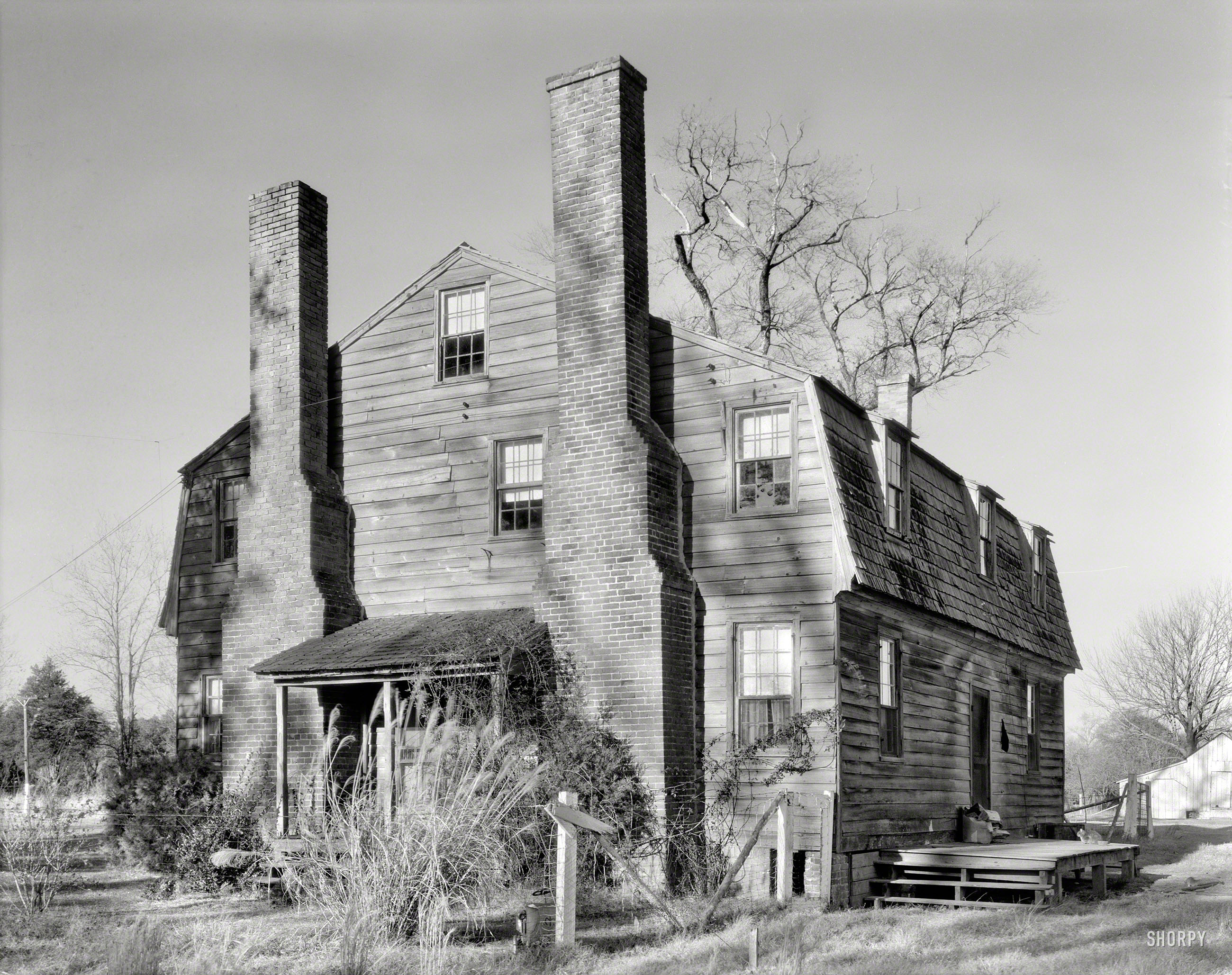 Circa 1935. "Reuben Lovett house, Princess Anne County, Virginia. Structure dates to 1790." 8x10 negative by Frances Benjamin Johnston. View full size.