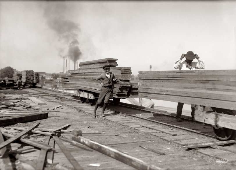 November 1913. Orange, Texas. "General Utility Boy at Lutcher &amp; Moore Lumber. 'I'm 14 years old; been here one year. Get $1 a day.' He runs errands and helps around. I saw him pushing some of these empty cars. Exposed to the weather and some danger. In the sawmill and planing mill I saw several boys who might be under 15." Photo and caption by Lewis Wickes Hine. View full size.
