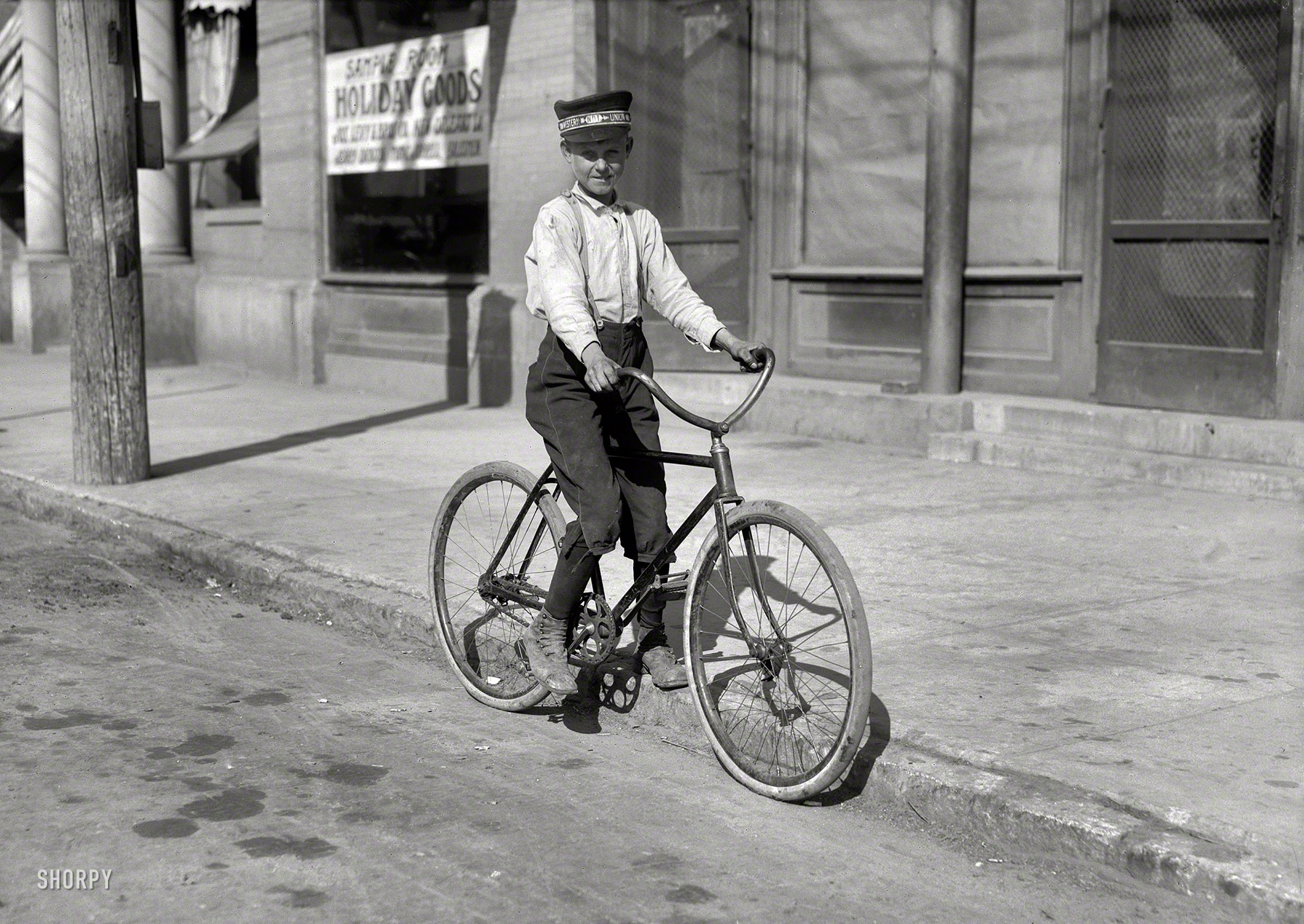 November 1913. Shreveport, Louisiana. "Western Union messenger No. 2, fourteen years old. Says he goes to the Red Light district all the time." Glass negative by Lewis Wickes Hine for the National Child Labor Committee. View full size.
