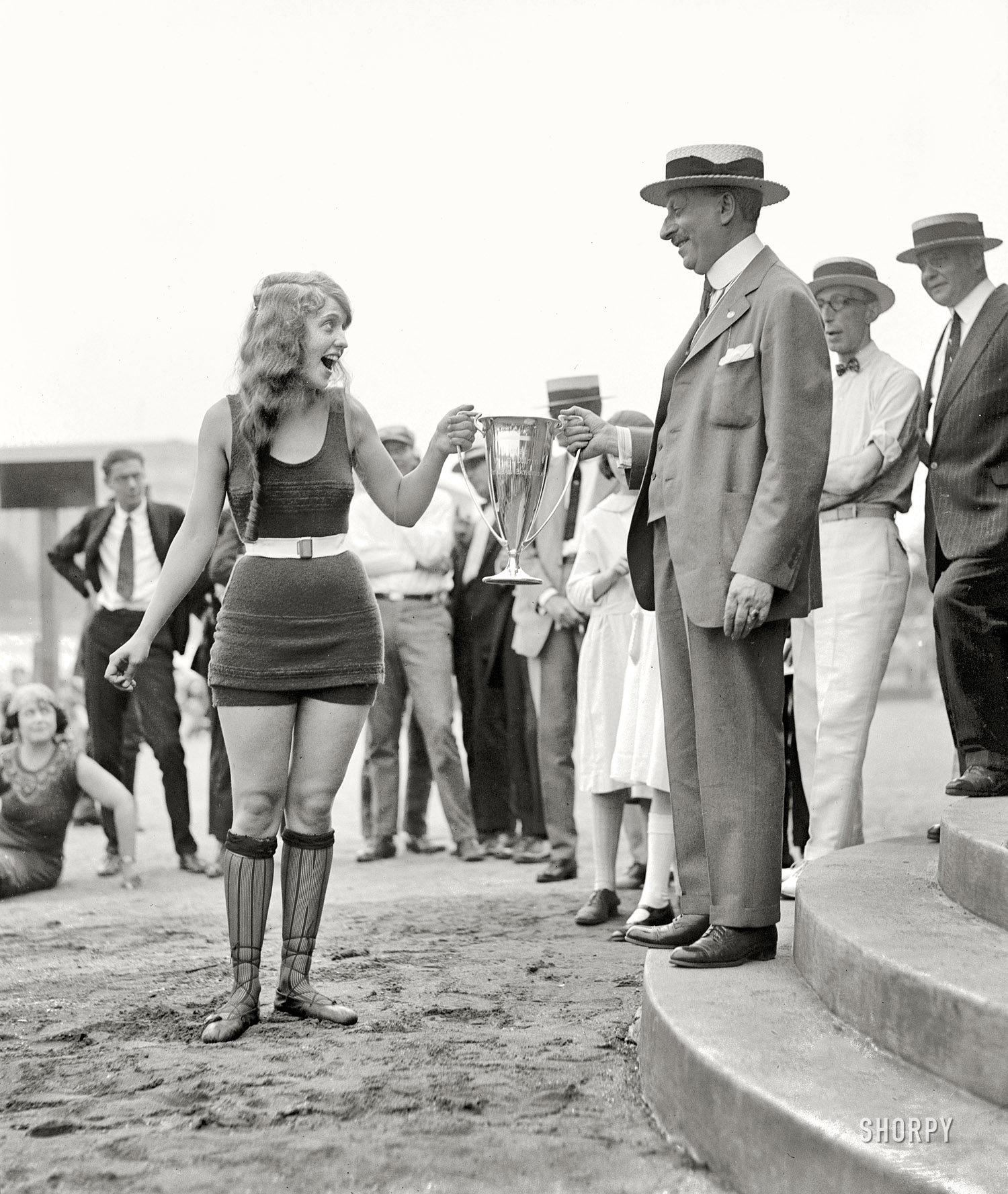 "Washington Tidal Basin Beauty Contest -- August 5, 1922." Seventeen-year-old Eva Fridell, last seen here and here, takes the loving cup from judge Isaac Gans. National Photo Company Collection glass negative. View full size.