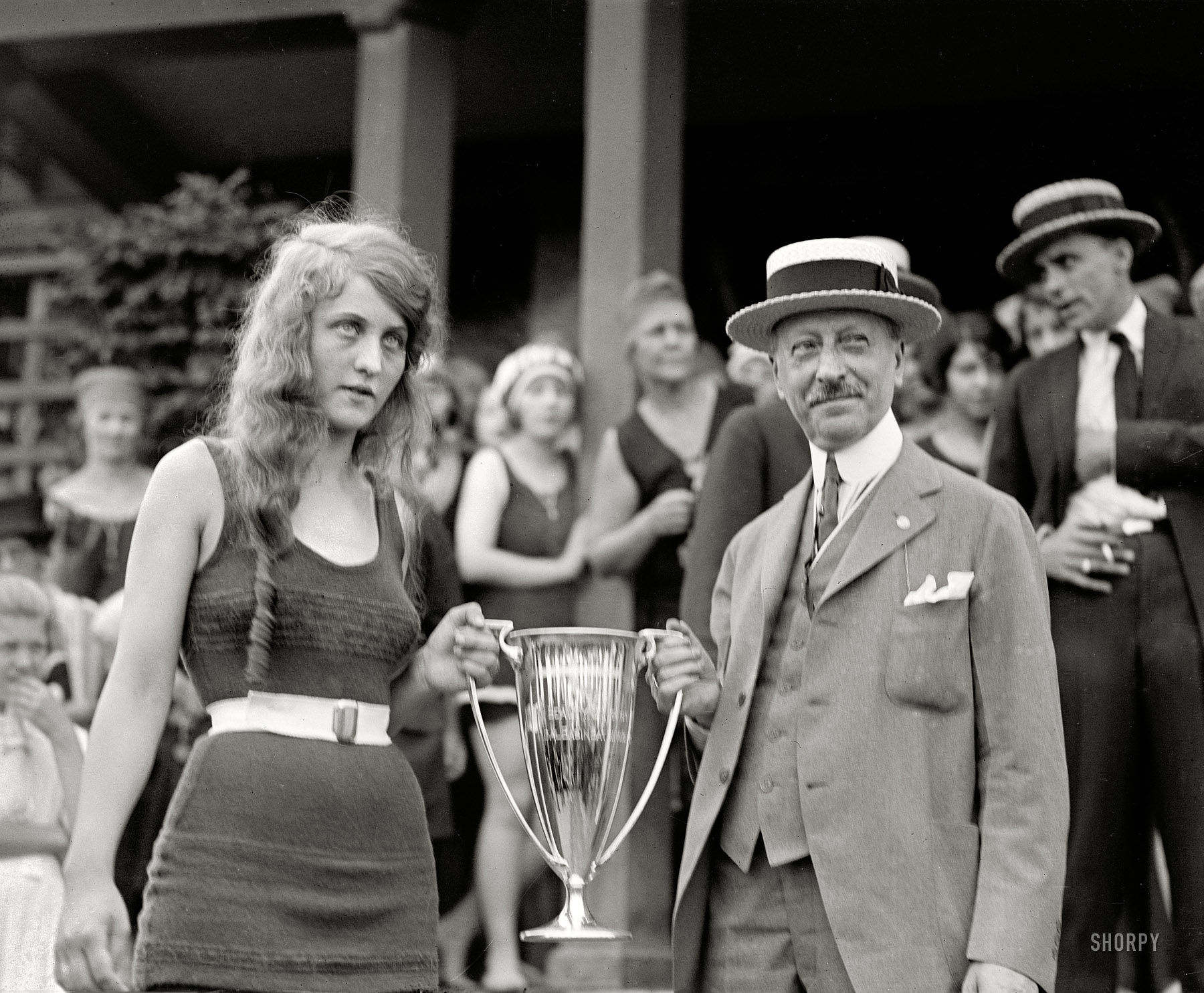 "Washington Tidal Basin Beauty Contest -- August 5, 1922." Prequel to the shot we saw yesterday: Seventeen-year-old Eva Fridell accepts first prize from judge Isaac Gans. National Photo Company Collection glass negative. View full size.