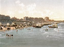 Circa 1890s-1900. "Beach and ladies' bathing place, Margate, England." Here we see a fixture of Victorian seaside resorts, the "bathing machine" -- a sort of horse-drawn cabana that was backed into the water and from which the lady would emerge, having changed into her bathing-petticoat, let out the back entrance by an attendant and, if an uncertain swimmer, tethered with a rope. Photochrom print, Catalogue J (1905), Detroit Publishing Company. View full size.