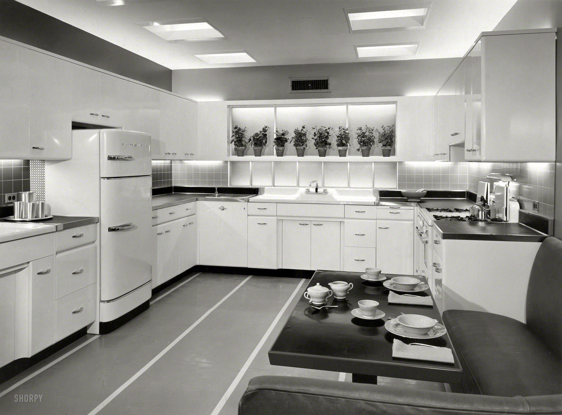 May 3, 1955. "Model kitchen in Chicago showroom. Advertisement for Crane fixtures." Presenting, if not the Kitchen of Tomorrow, at least the Breakfast Nook of Next Wednesday. Photo by Bill Hedrich, Hedrich-Blessing Studio. New York World-Telegram and Sun Newspaper Photograph Collection. View full size.