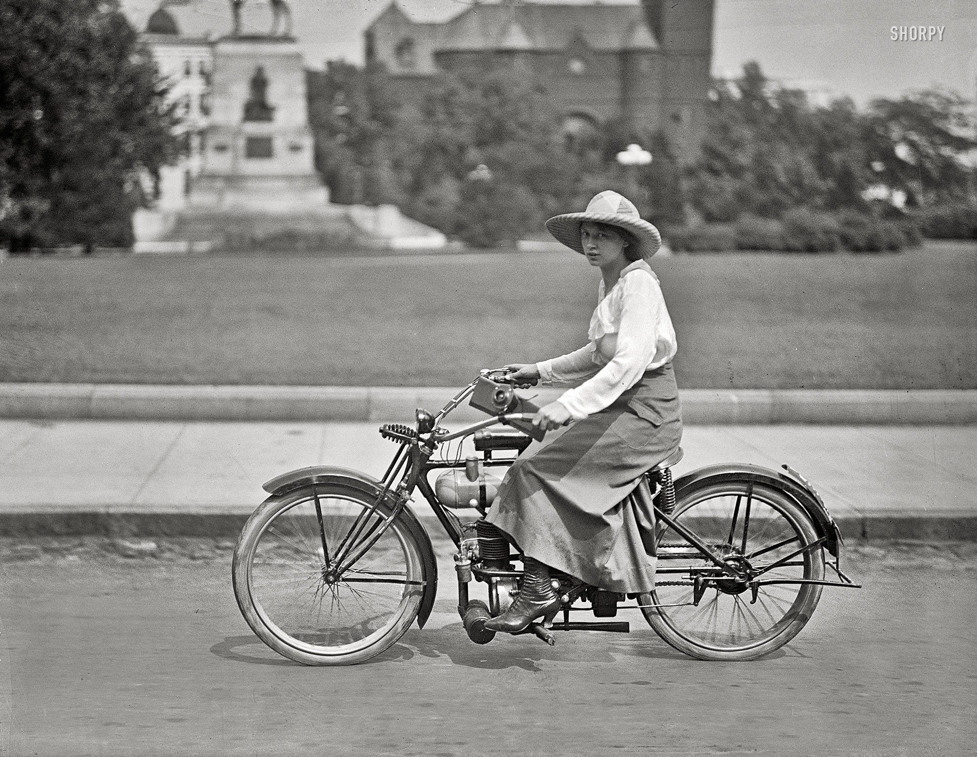 Washington, D.C., circa 1918. "Woman on motorized bicycle." What won't they think of next! Harris & Ewing Collection glass negative. View full size.