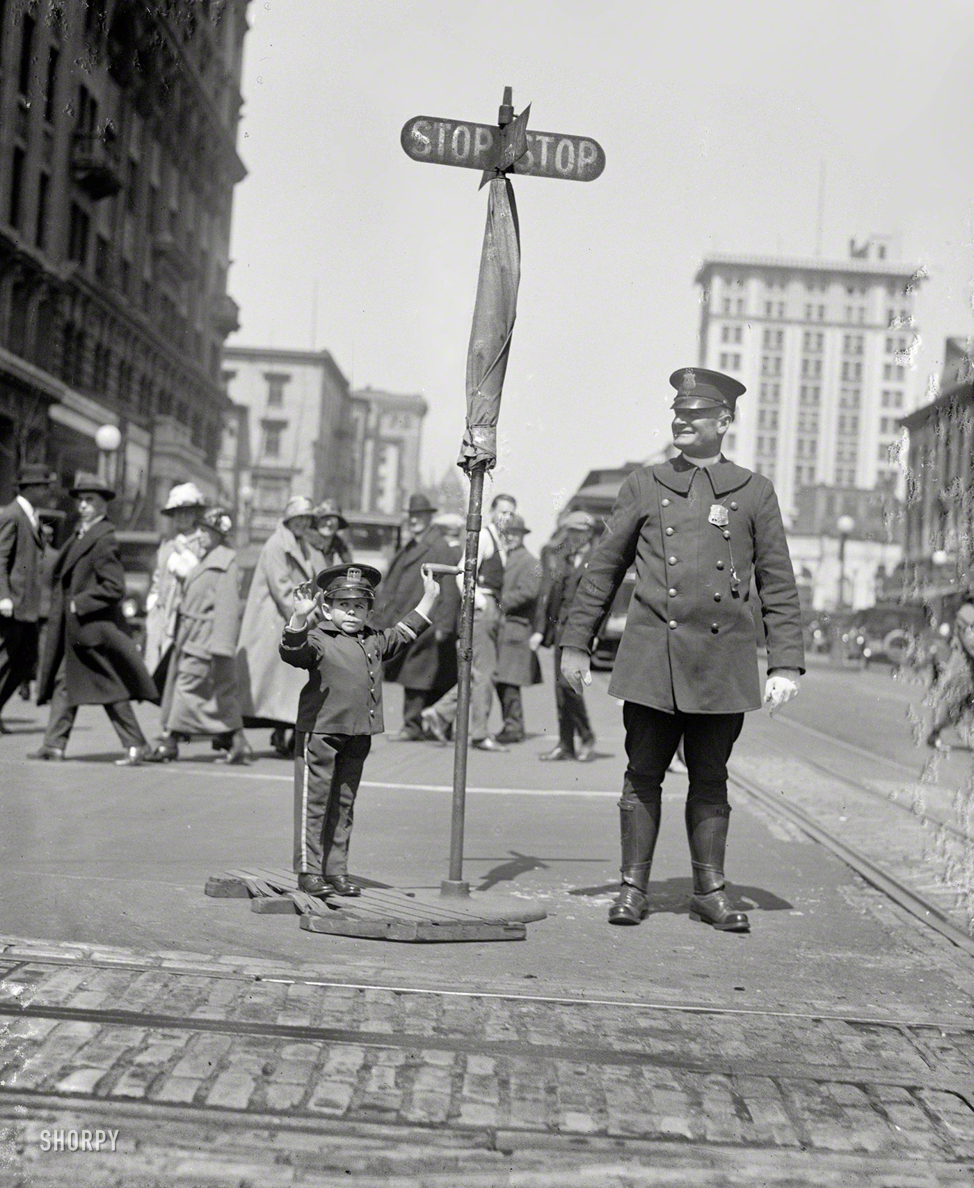 April 8, 1924. Washington, D.C. "Julius Daranyi, midget traffic cop." From the Washington Post: "Julius Daranyi, one of the stars with Singer's midgets playing at B.F. Keith's theater this week, will become a member of the District of Columbia police force today and take up his first detail at Fourteenth and G streets, at 12:30 o’clock, where he will direct traffic." National Photo Co. View full size.