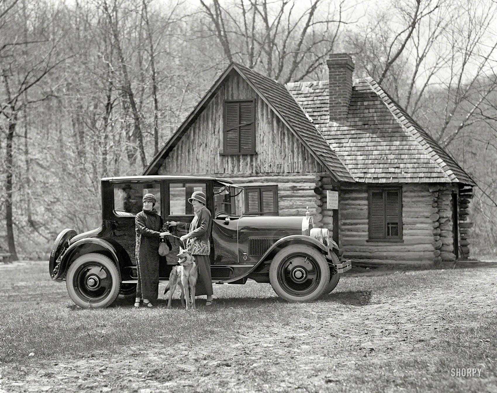 Washington, D.C., 1924. "Washington Hunt motor car." The building is the Joaquin Miller cabin at Rock Creek Park. National Photo Co. View full size.