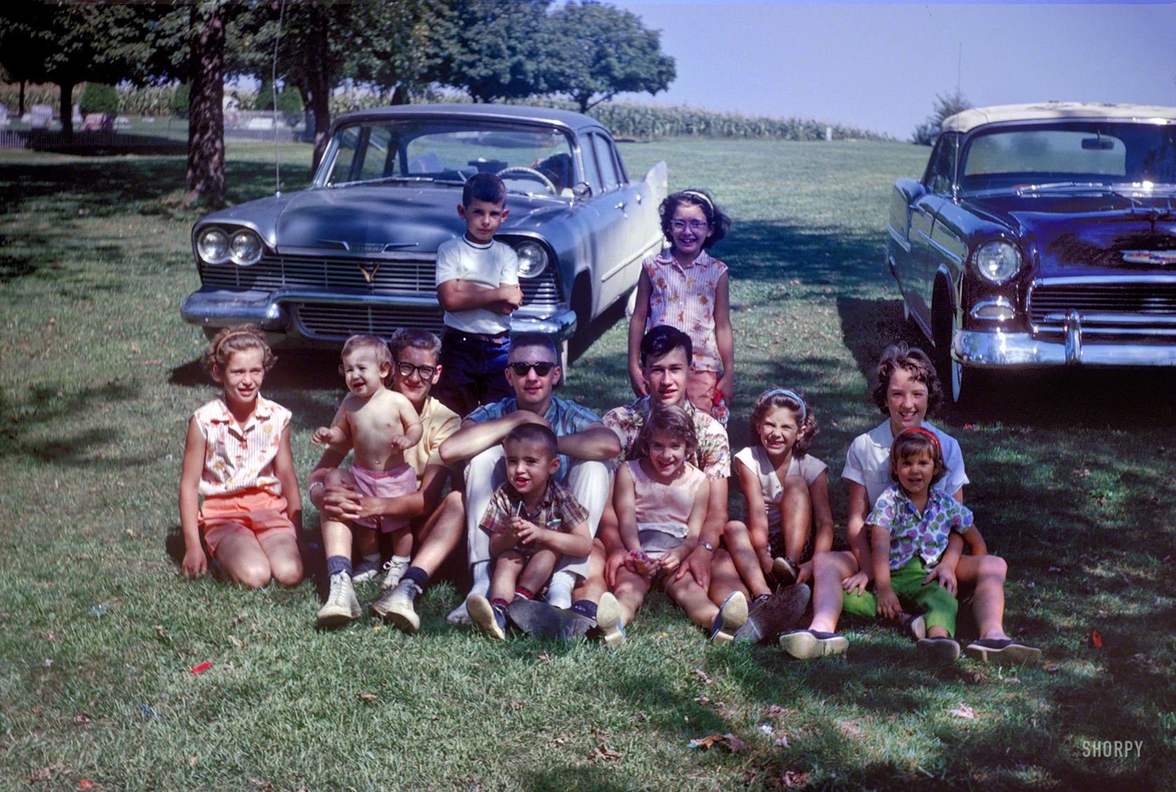 "Adams Reunion, 1962." Somewhere in Maryland or Pennsylvania, it's Kermy at left with the glasses, sister Janet on the right with tot and Dale with the watch, relationship unknown. A nice day in the cemetery-cornfield. View full size.