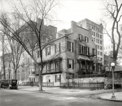 Washington, D.C., circa 1920. "Cameron House." Bonus points to the first person to supply an address or Street View.  Harris &amp; Ewing glass neg. View full size.
Benjamin Ogle Tayloe House21 Madison Place NW
Still ThereThe building is on Lafayette Square, within a stone's throw of the White House. The street in front is now a pedestrian walkway; the view here is from H Street.
[Barely visible here behind the trees, between the red and tan buildings. - Dave]
View Larger Map
Federal Circuit Library717 Madison Pl NW.
Washington D.C., DC 20439-0001
Right next door to the Treasury Dept. Federal Credit Union.
717 Madison Place NWAccording to this photo from the Library of Congress, this house was next to the Belasco Theater, with a "glimpse of [U.S.] Treasury building in background", which places it at around 717 Madison Place NW, next to Lafayette Square.
Meanwhile, according to this photo of the aforementioned Belasco Theater, "in the early 60s, with the reconstruction of Lafayette Square, many of the Belasco's neighbors were razed, until finally, in 1964, the Belasco itself was torn down to make way for the new US Court of Claims Building." I imagine the Cameron House was one of those razed.
Hint:  SuffragetteAnd, the year before Women were given the vote!
Lafayette SquareI think it was at 18 Lafayette Square, since that's where Grant's Secretary of War, J. Donald Cameron, built a mansion.
National Womens PartyNWP headquarters beginning in 1916. House had previously served as the National Congressional Union Convention headquarters. Here is an image in front of the house with the women about to march on the nearby White House:
Shut that car door!The Keystone Kops will be coming through shortly and you just KNOW they would drive by and take the door off with their car.
(The Gallery, D.C., Harris + Ewing)
