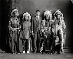 Washington, D.C., circa 1917. "Indians: Redwater and group." My headdress was at the cleaners. Harris & Ewing Collection glass negative. View full size.