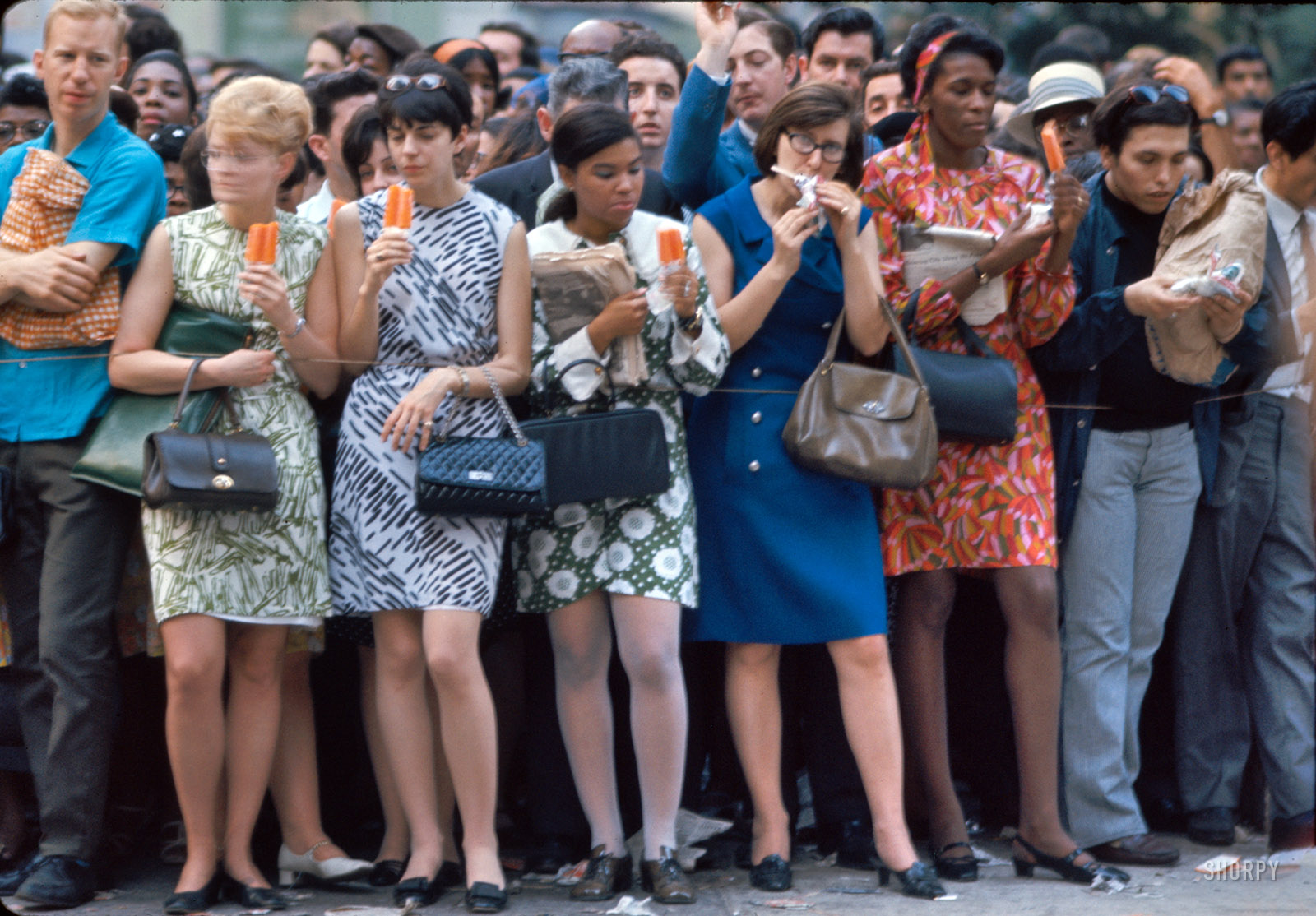 June 8, 1968. "Funeral cortege of Robert F. Kennedy." More of the mourners who lined the route of RFK's funeral train as it made its way from New York to Washington. The mood may have been blue, but the Popsicles were not. Photos by Paul Fusco and Thomas Koeniges for Look magazine. View full size.