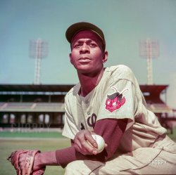Sept. 1952. "St. Louis Browns pitcher Satchel Paige." Sporting Brownie the Elf. Kodachrome by Look magazine staff photographer Bob Lerner. View full size.