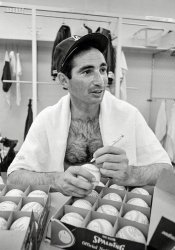 April 12, 1966. "Sandy Koufax, pitcher for the Los Angeles Dodgers, in the locker room signing baseballs." Photo by Phil Bath for Look magazine. View full size.