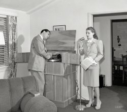 1940. "Lana Turner and Artie Shaw with audio recording system in their Beverly Hills Home." Possibly rehearsing a movie script. Photo by Earl Theisen for the Look magazine article "Lana Turner and Artie Shaw at Home." View full size.