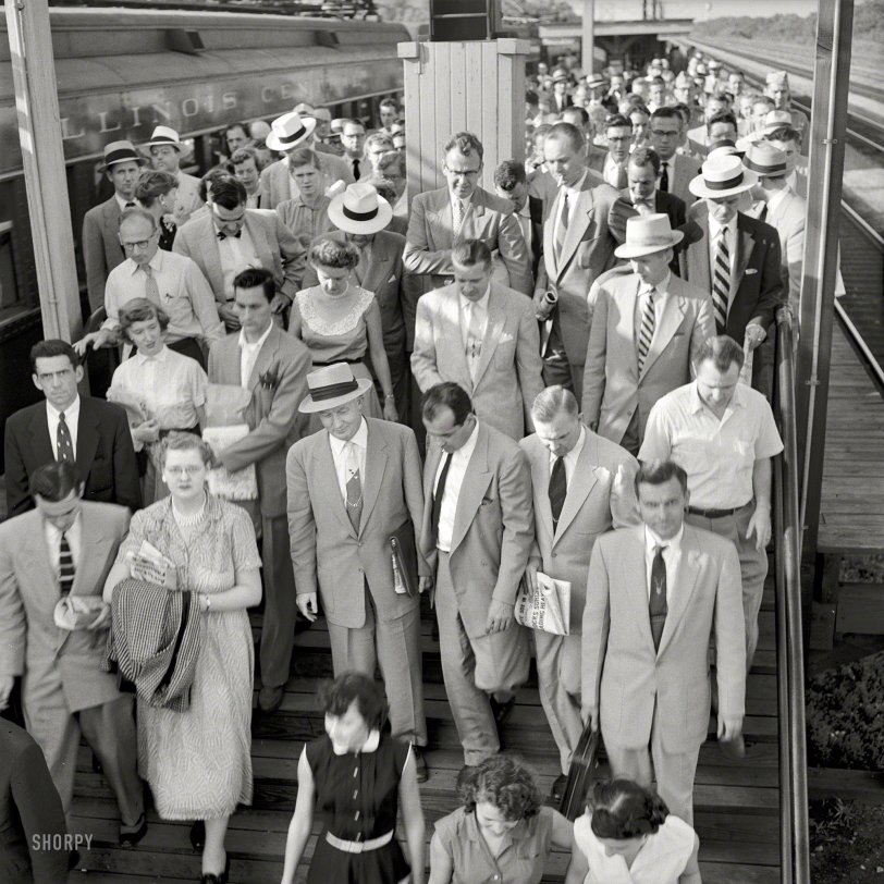 July 1954. "Commuters on platform after getting off train. Park Forest, Illinois." Photo by Bob Sandberg for Look magazine. View full size.