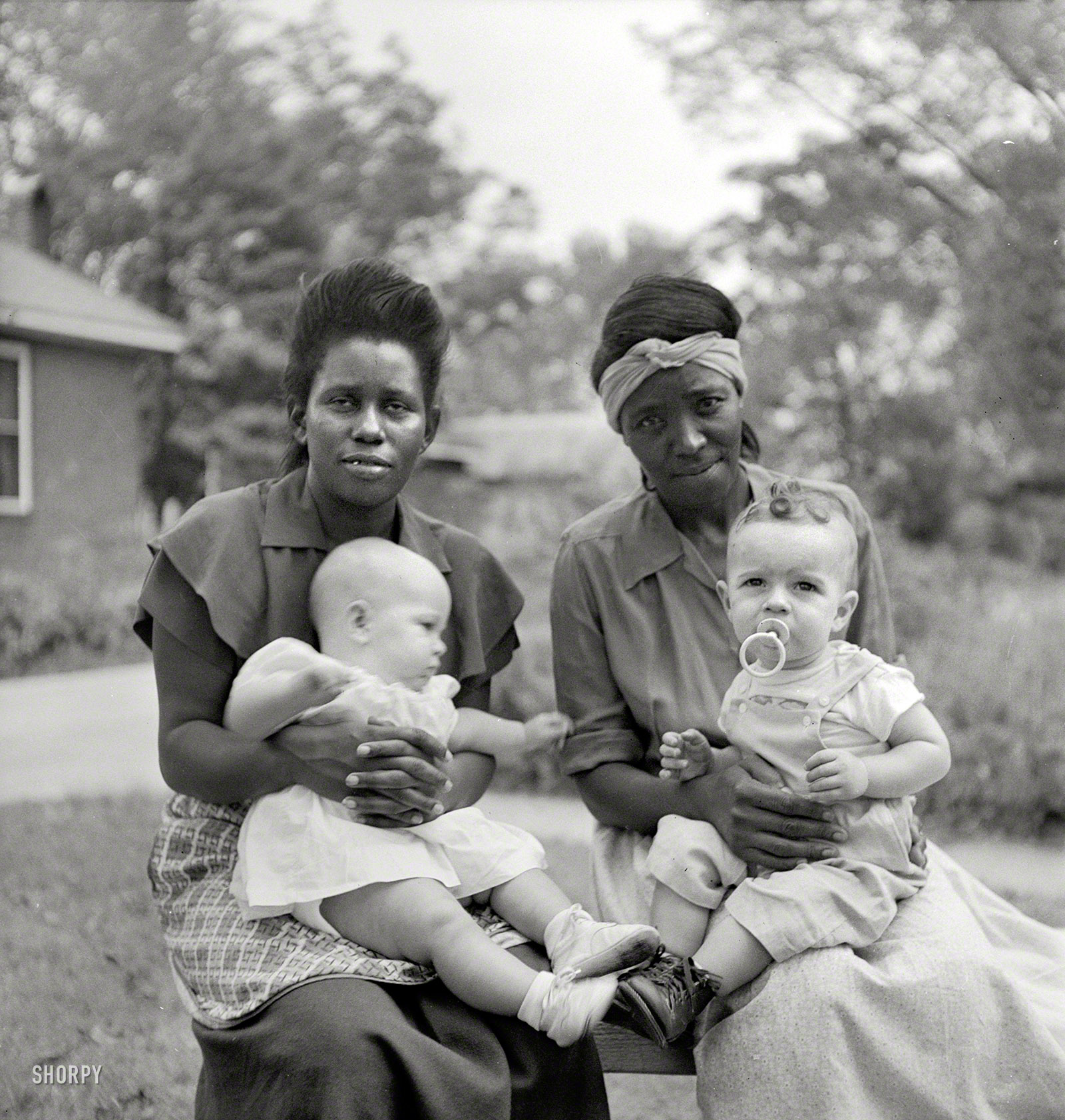 1951, somewhere in the Southeast. "Negro maids and their white employers' babies." Photo by John Vachon for a Look magazine assignment on "The South" in what could have been a prologue to "The Help." View full size.