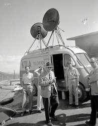 1952. "Journalists standing in front of a KTLA television truck at Camp Mercury Proving Grounds; present to record an atomic bomb detonation in the Nevada desert." Photo by Maurice Terrell for Look magazine. View full size.