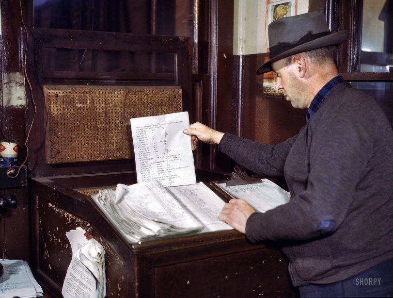 December 1942. "Switch lists coming in by teletype to the hump office at a Chicago &amp; North Western railroad yard, Chicago." 4x5 Kodachrome transparency by Jack Delano for the Office of War Information. View full size.
