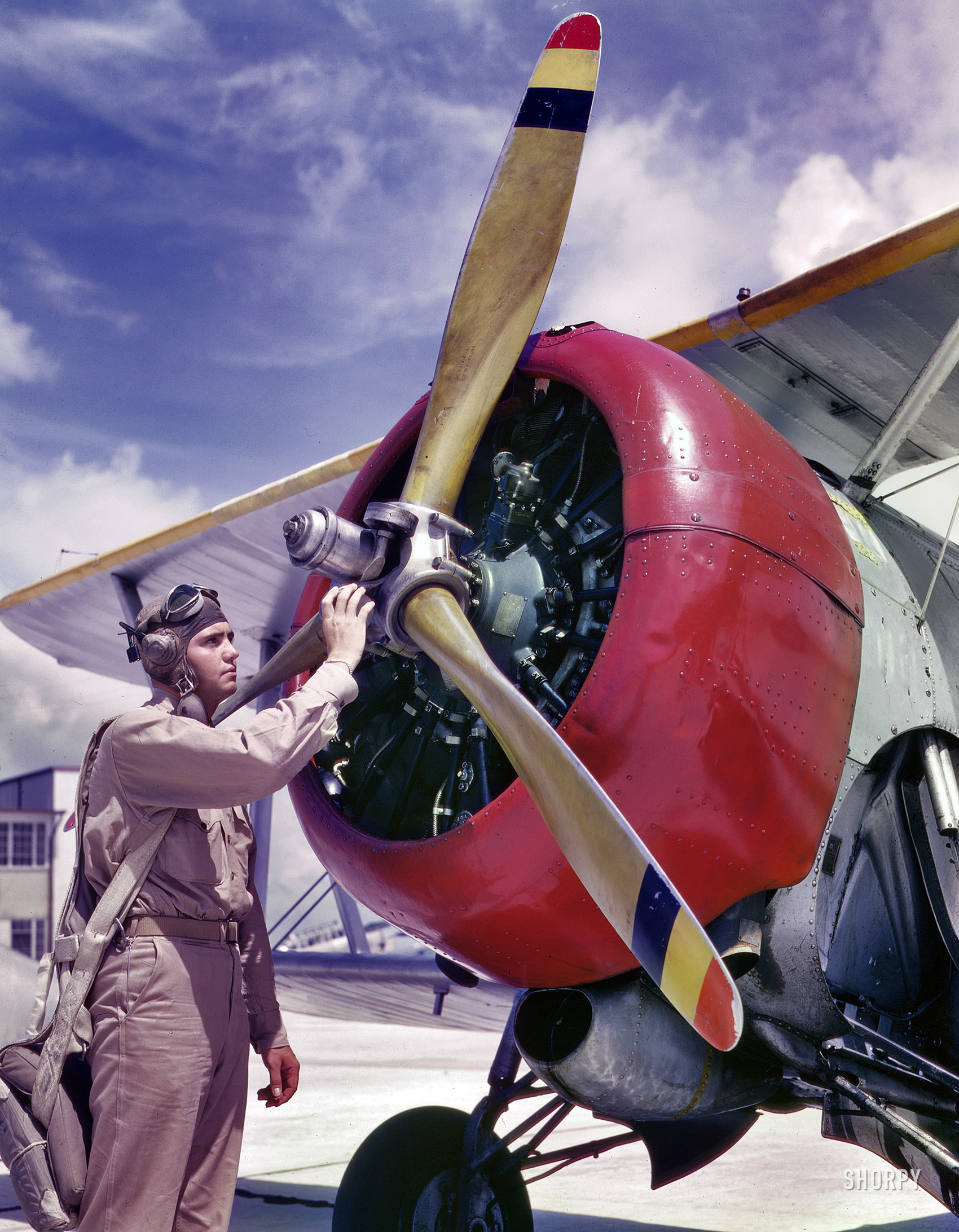 August 1942. Corpus Christi, Texas. "Aviation Cadet Thanas at Naval Air Base." 4x5 Kodachrome by Howard Hollem, Office of War Information. View full size.