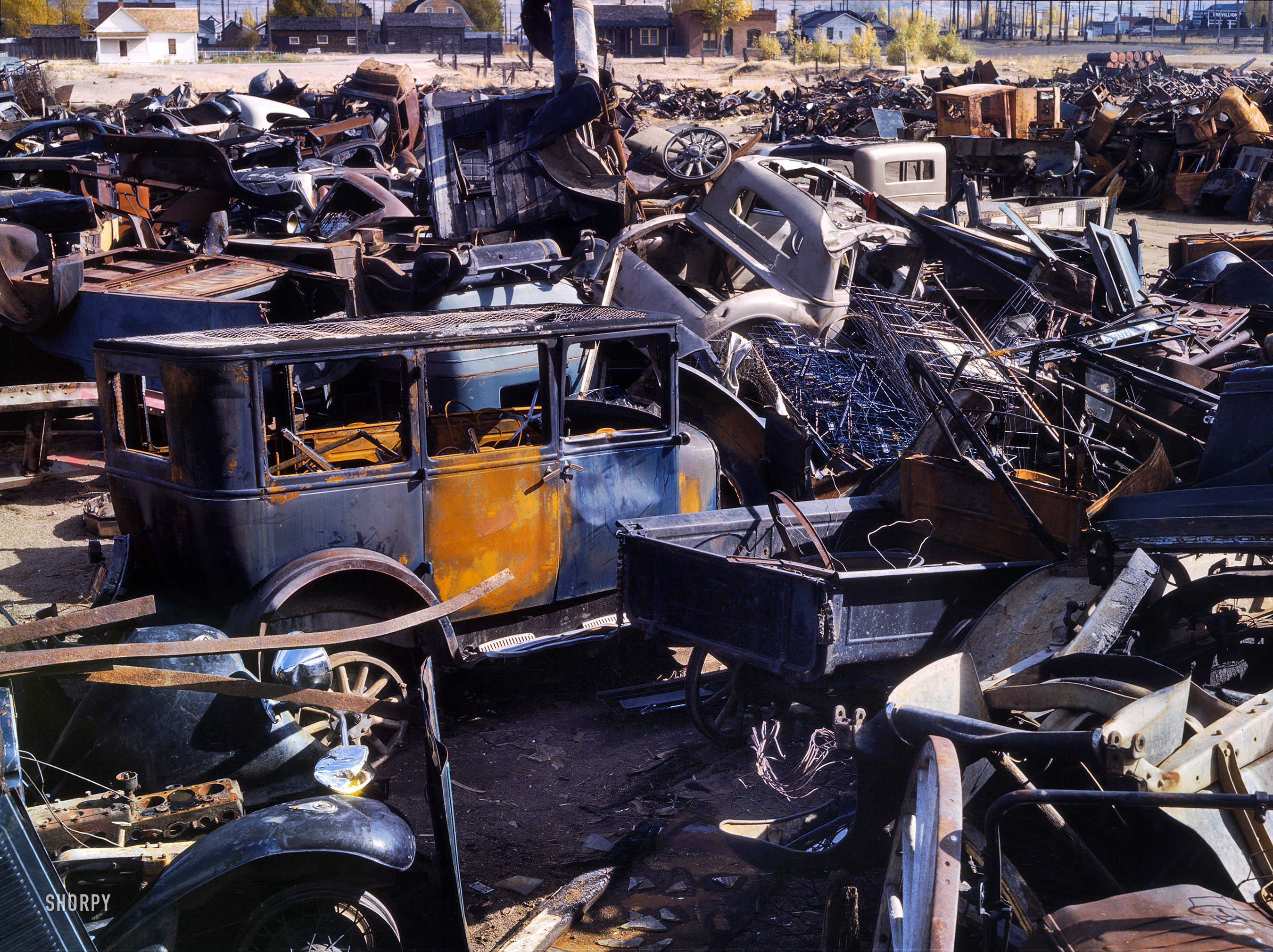 October 1942. "Scrap and salvage depot in Butte, Montana." 4x5 Kodachrome transparency by Russell Lee for the Office of War Information. View full size.