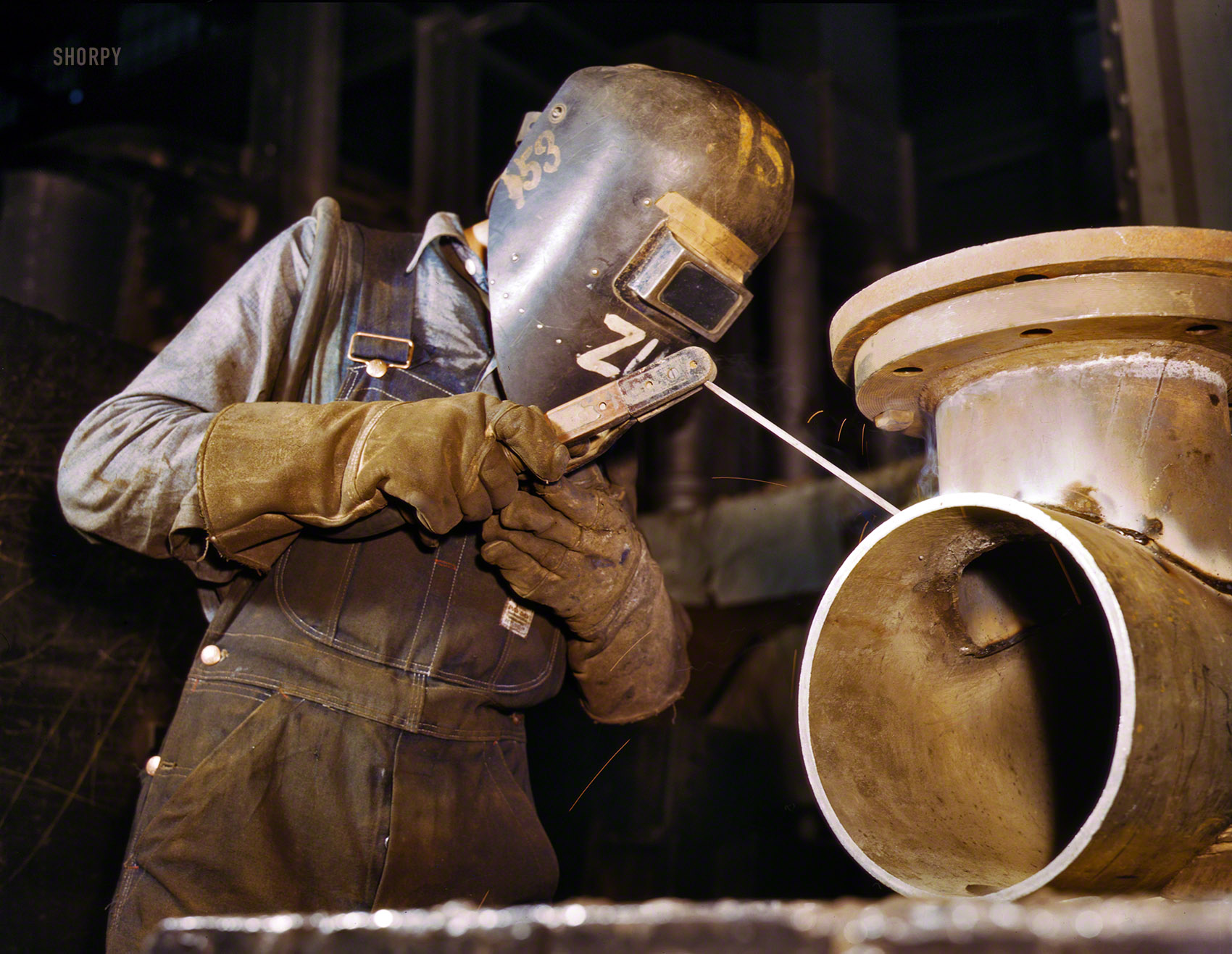 June 1942. "Combustion Engineering Co., Chattanooga, Tennessee. Welder making boilers for a ship." A definite 1950s sci-fi vibe here. 4x5 Kodachrome transparency by Alfred Palmer, Office of War Information. View full size.