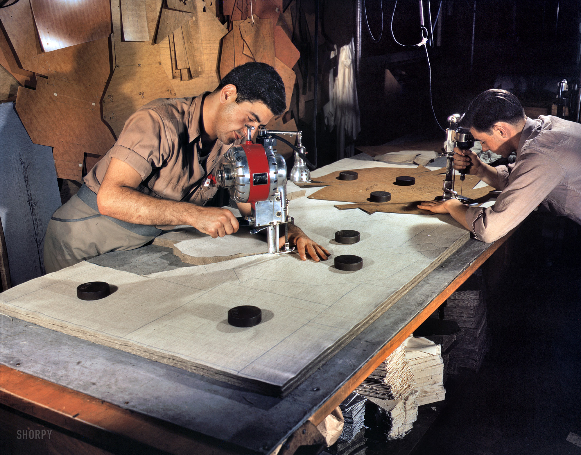 August 1942. Manchester, Connecticut. "The utmost precision is required of these operators who are cutting and drilling parachute packs in an Eastern factory. Their work is under constant close supervision. Pioneer Parachute Company." 4x5 Kodachrome transparency by William M. Rittase, OWI. View full size.