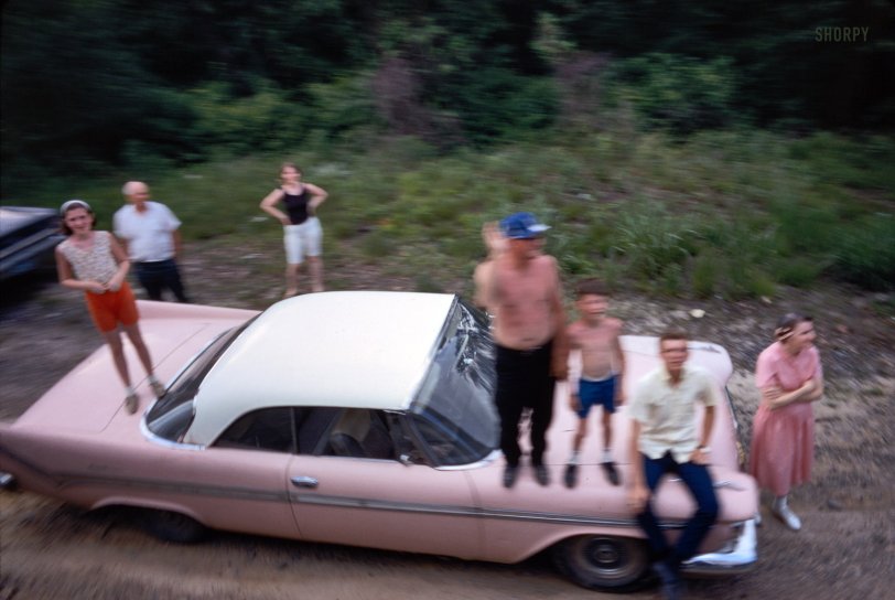 June 8, 1968. "Funeral cortege of Robert F. Kennedy." Mourners atop a pink DeSoto viewing RFK's funeral train as it made its way from New York to Washington. 35mm Kodachrome transparency from photos by Paul Fusco and Thomas Koeniges for Look magazine. View full size.
