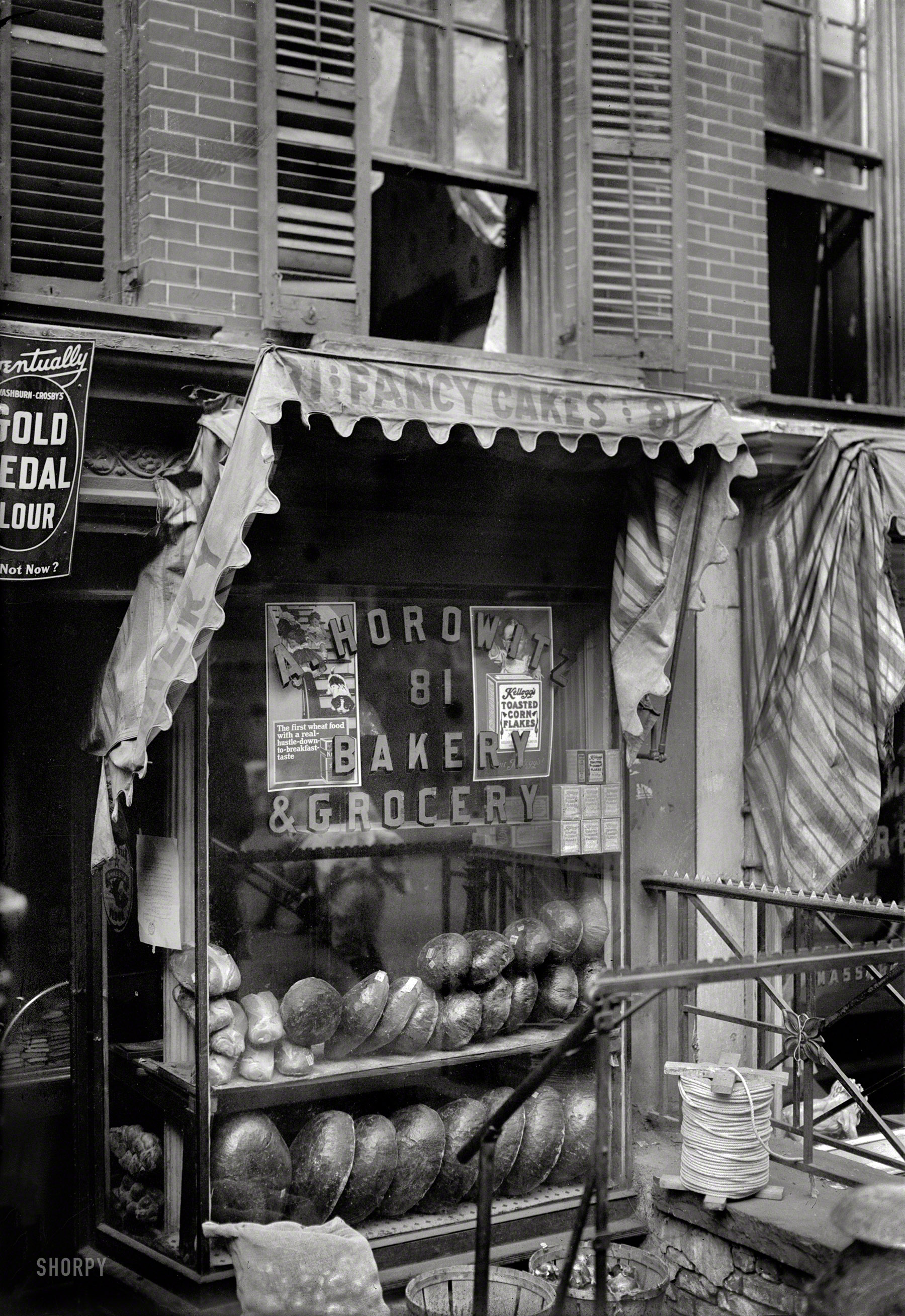 New York circa 1910, somewhere on the Lower East Side. "Bread for the poor." 5x7 glass negative, George Grantham Bain Collection. View full size.