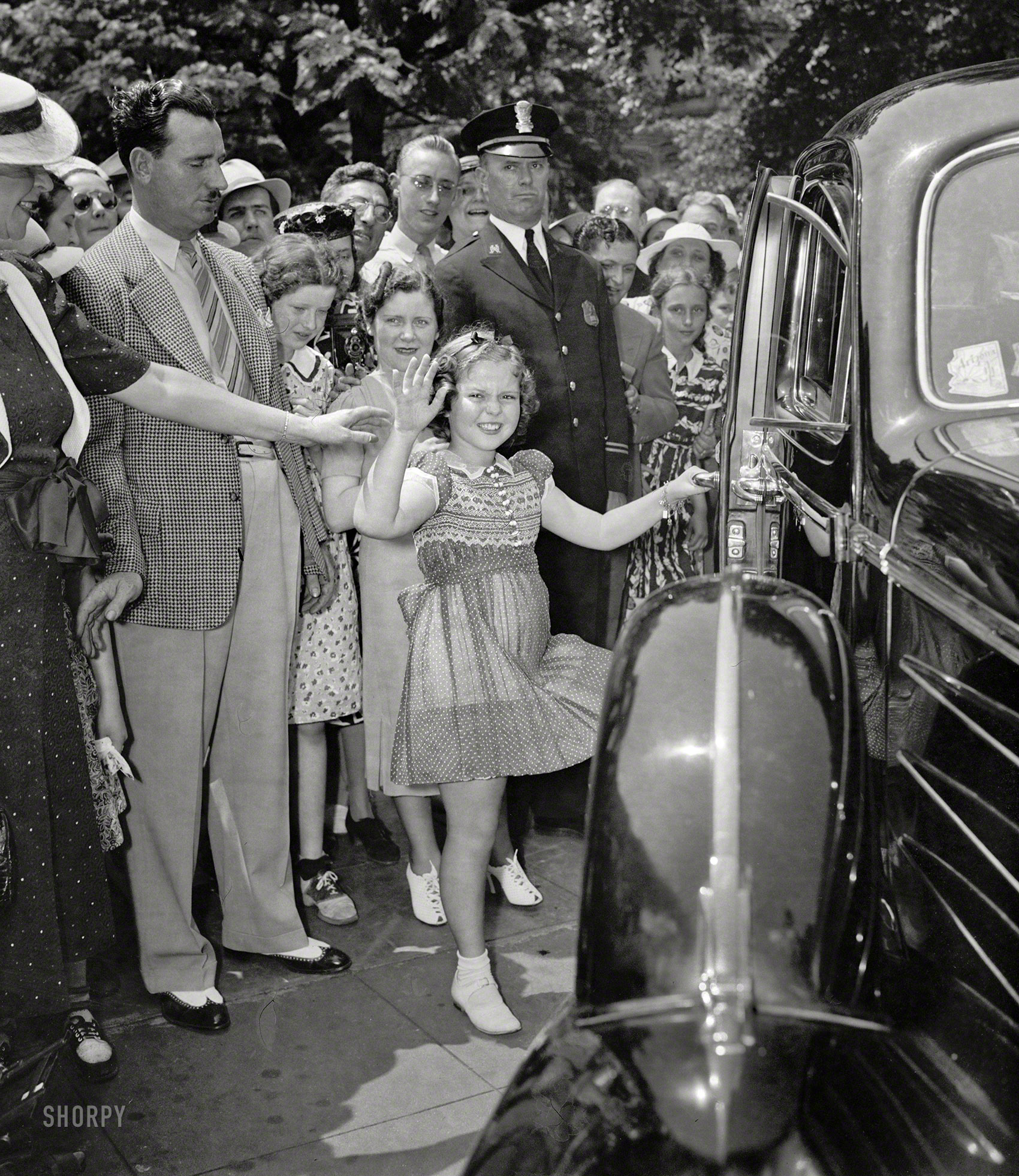 Shirley Temple Black, Screen Darling, Is Dead at 85
June 24, 1938. "Shirley sees her old friend the president. Shirley Temple leaving the White House today after a very important conference with the President. Shirley told Mr. Roosevelt about losing a tooth last night, and he told her about Sistie and Buzzie losing their teeth. Shirley expects to be in Washington a week checking on the affairs of state with different government officials." Harris & Ewing Collection glass negative. View full size.