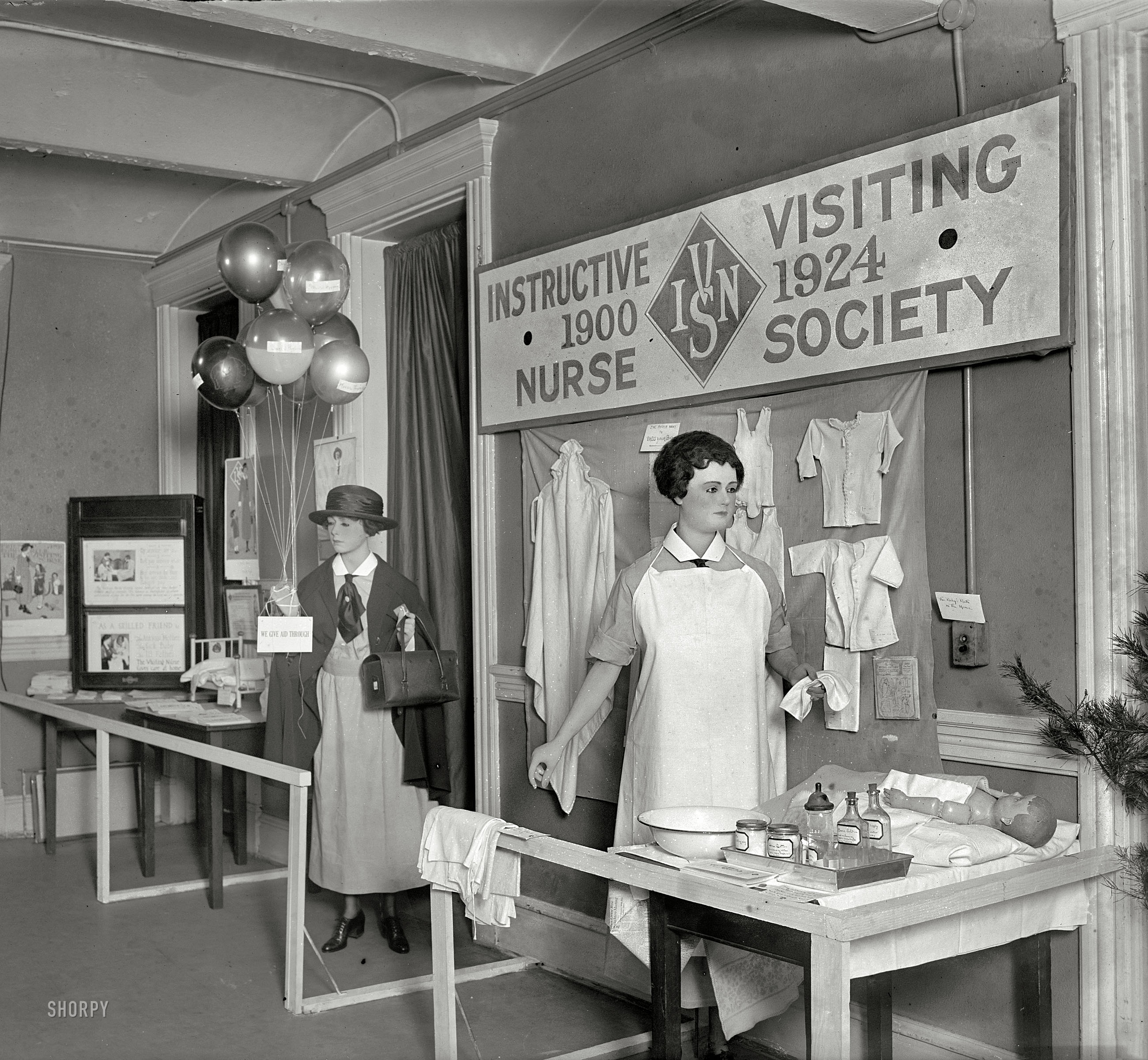 April 1924. Washington, D.C. "Health Week. Instructive Visiting Nurse Society exhibit." Tips on "The Proper Way to Dress Your Baby," and "The Baby's Bath in the Home." National Photo Company Collection glass negative. View full size.