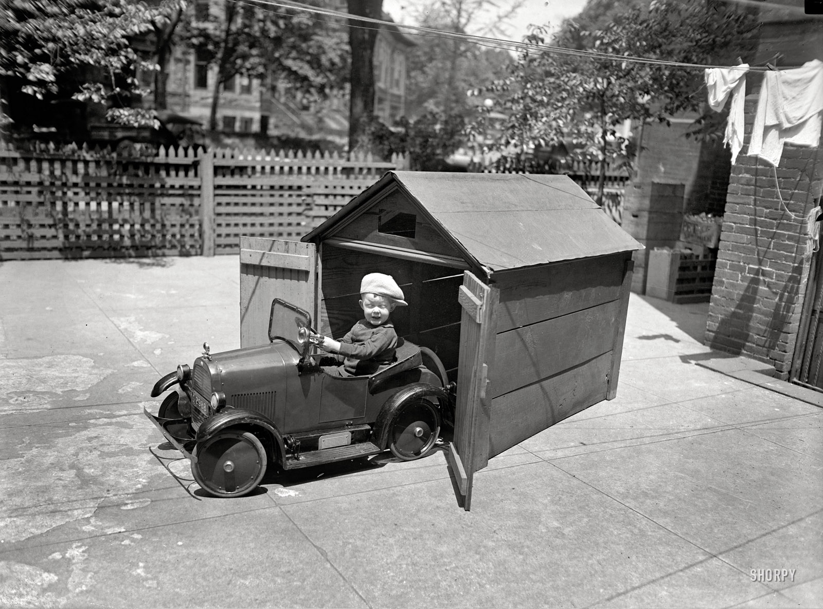 May 19, 1925. "Rogers Curtis Johnson." Headed out for a little spin. National Photo Company Collection glass negative. View full size.