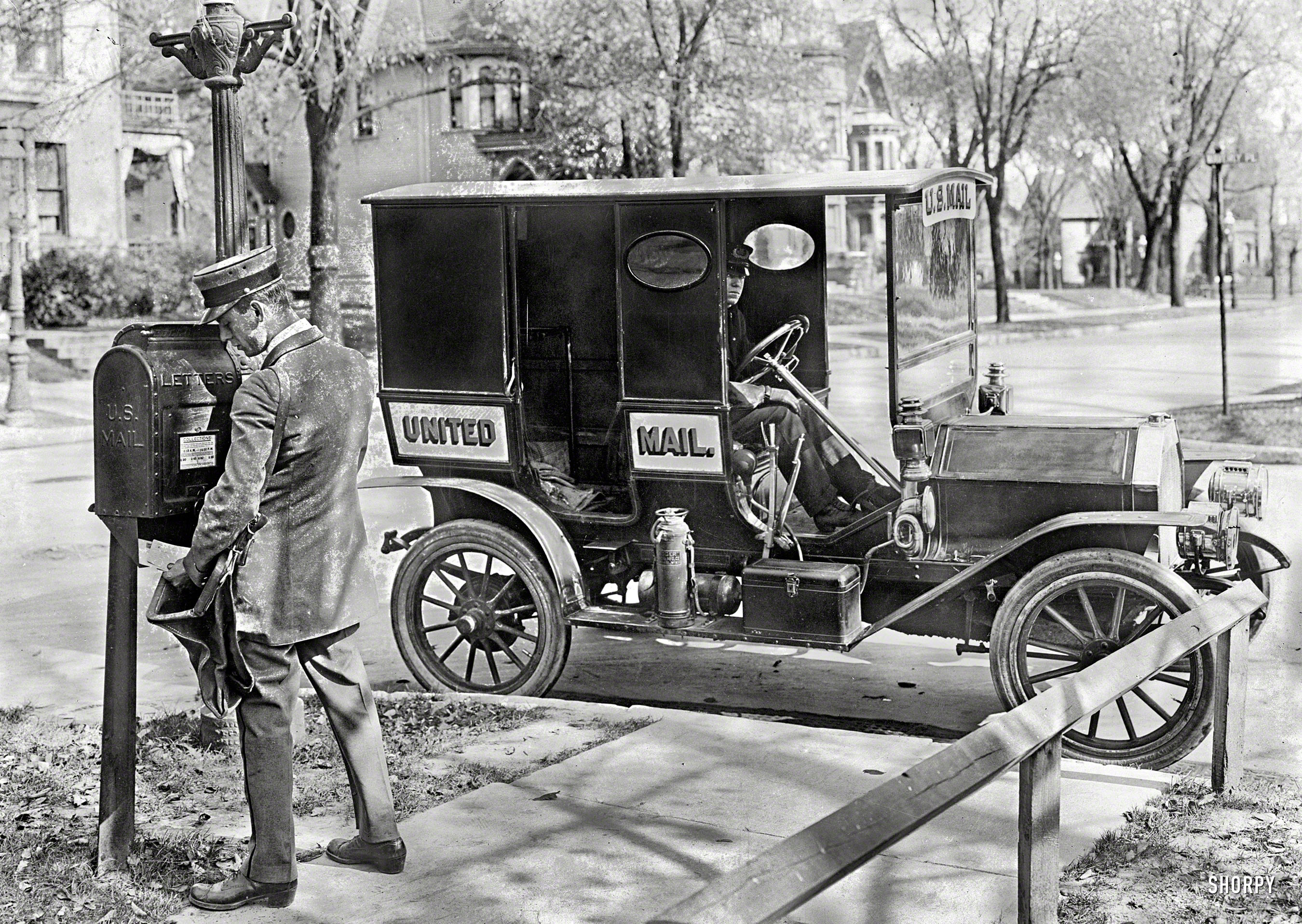 Circa 1915. "Mailman and truck," location unknown. Collection times 6:15 a.m. to noon. National Photo Company Collection glass negative. View full size.
