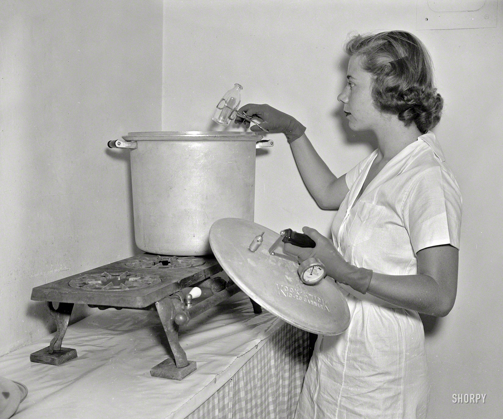 August 18, 1937. Washington, D.C. "Baby Service, Inc. Miss Ann Turner sterilizing bottles." Harris & Ewing Collection glass negative. View full size.