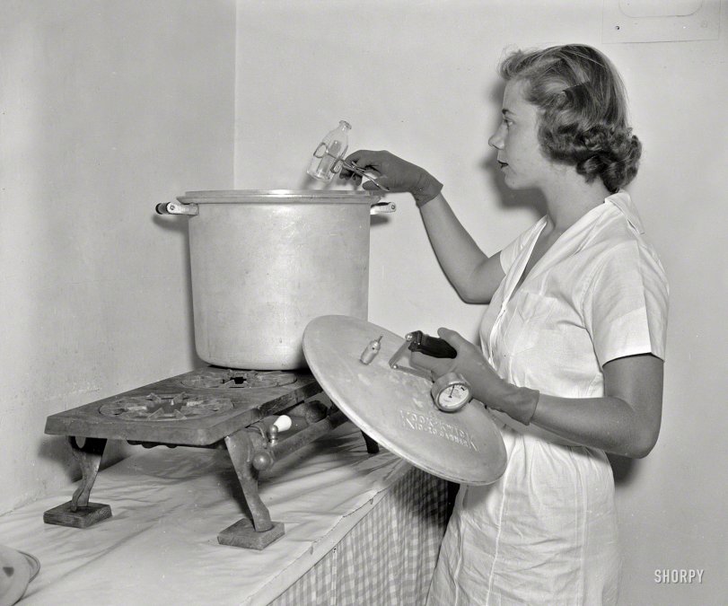 August 18, 1937. Washington, D.C. "Baby Service, Inc. Miss Ann Turner sterilizing bottles." Harris &amp; Ewing Collection glass negative. View full size.

