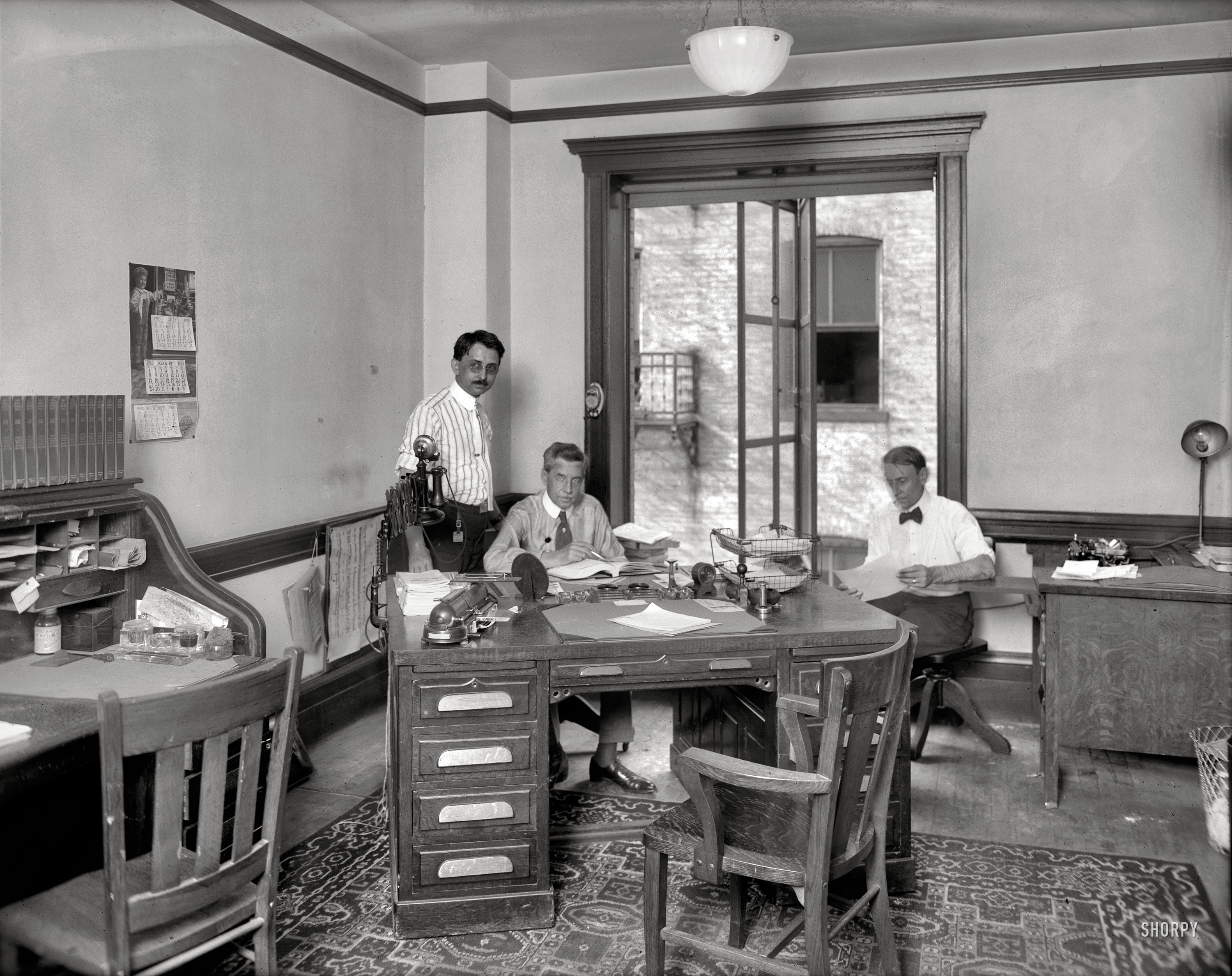 Washington, D.C., 1920. "Faulkner Inc. -- office interior." And a well-equipped office it is. National Photo Company Collection glass negative. View full size.