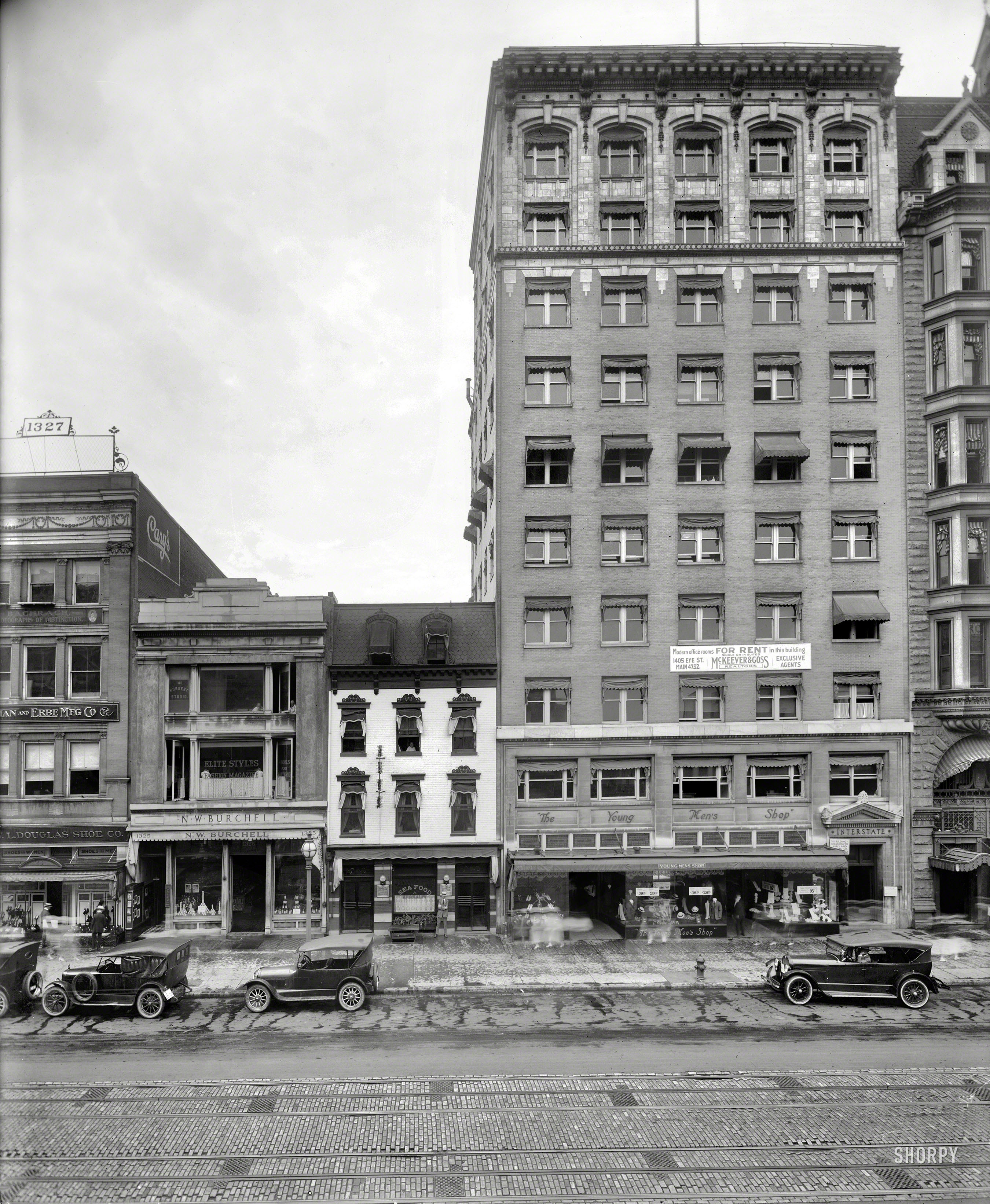 Washington, D.C., 1921. "Interstate Building, F Street N.W." Sharing the sidewalk with the Young Men's Shop, Losekam's Cafe and a smattering of spectral pedestrians. National Photo Company Collection glass negative. View full size.