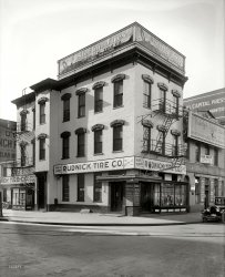 Washington, D.C., circa 1921. "Rudnick Tire Co., front." With perhaps Rudnick himself. National Photo Company Collection glass negative. View full size.
All goneB.S. Reynolds next door to Rudnick were located at 1202 D Street NW.
Rudnick Tire: 1921Per 1920 census, Rudnick was David Samuel Rudnick. He was born in 1883 in Galveston, Texas. He was the son of Russian-Jewish parents. In 1911, he entered the US in Laredo, Texas, from Mexico, and reported his destination as New York City. In the 1930 census, he was still in Washington, and worked as a "credit specialist" in the auto business. He was married to Henrietta, and had a 17-year old daughter named Eileen. He moved around quite a bit. According to his WWII draft registration, he was living in 1942 with Henrietta in Philadelphia. He listed his employer as Remington Rand Co. Per California Death Index, he died in San Diego on June 29, 1951. 
Tireless RudnickRe joemanning's David Rudnick bio-ette: There's no way that's the Rudnick that ran this emporium because nothing there points to his owning one. The only auto industry gig he had, apparently, was "credit specialist". I googlefied the tire company, checked D.C. business directories, etc. but found nothing helpful. Looks like this case is closed, Mr. Chan. 
(The Gallery, Cars, Trucks, Buses, D.C., Natl Photo)