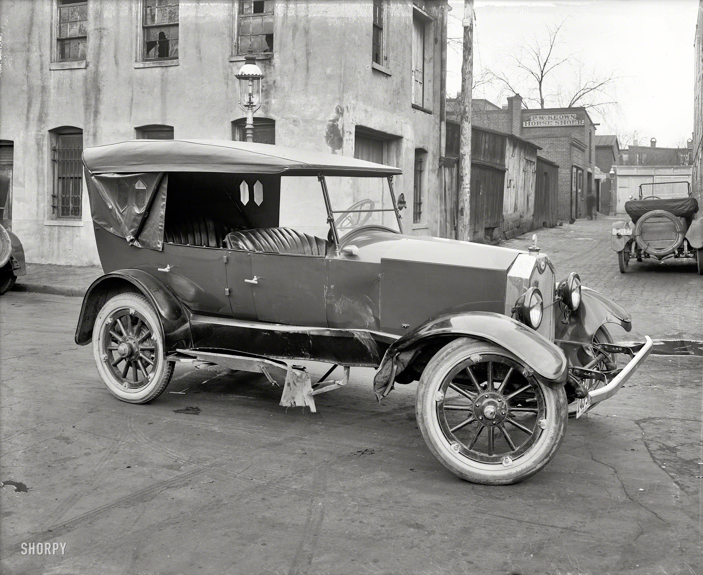 Washington, D.C., 1921. "Potomac Sales Co., wreck." Just up the alley from P. McKeown, Horse Shoer. National Photo Co. glass negative. View full size.