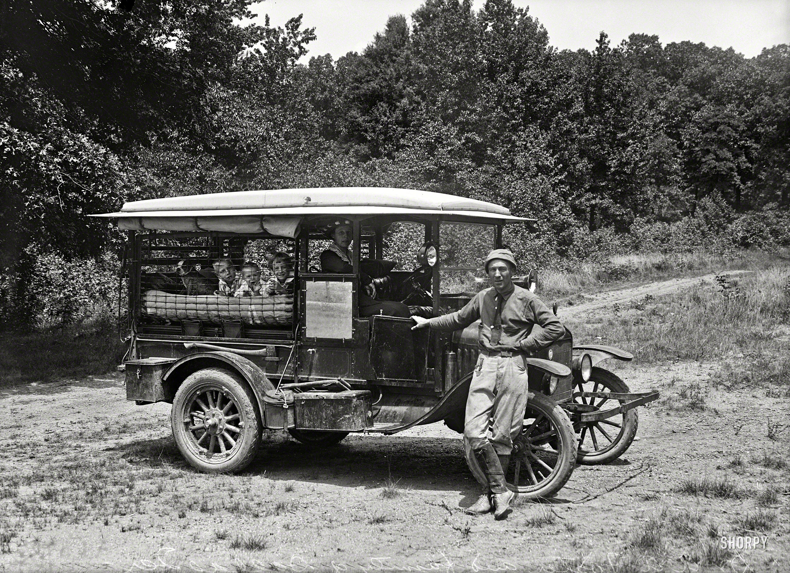 Washington, D.C., or vicinity circa 1920. "Dr. A.A. Foster and family of Dallas, Texas." A second look at the auto-tourists seen here yesterday, and their modified Model T Ford. Harris & Ewing glass negative. View full size.