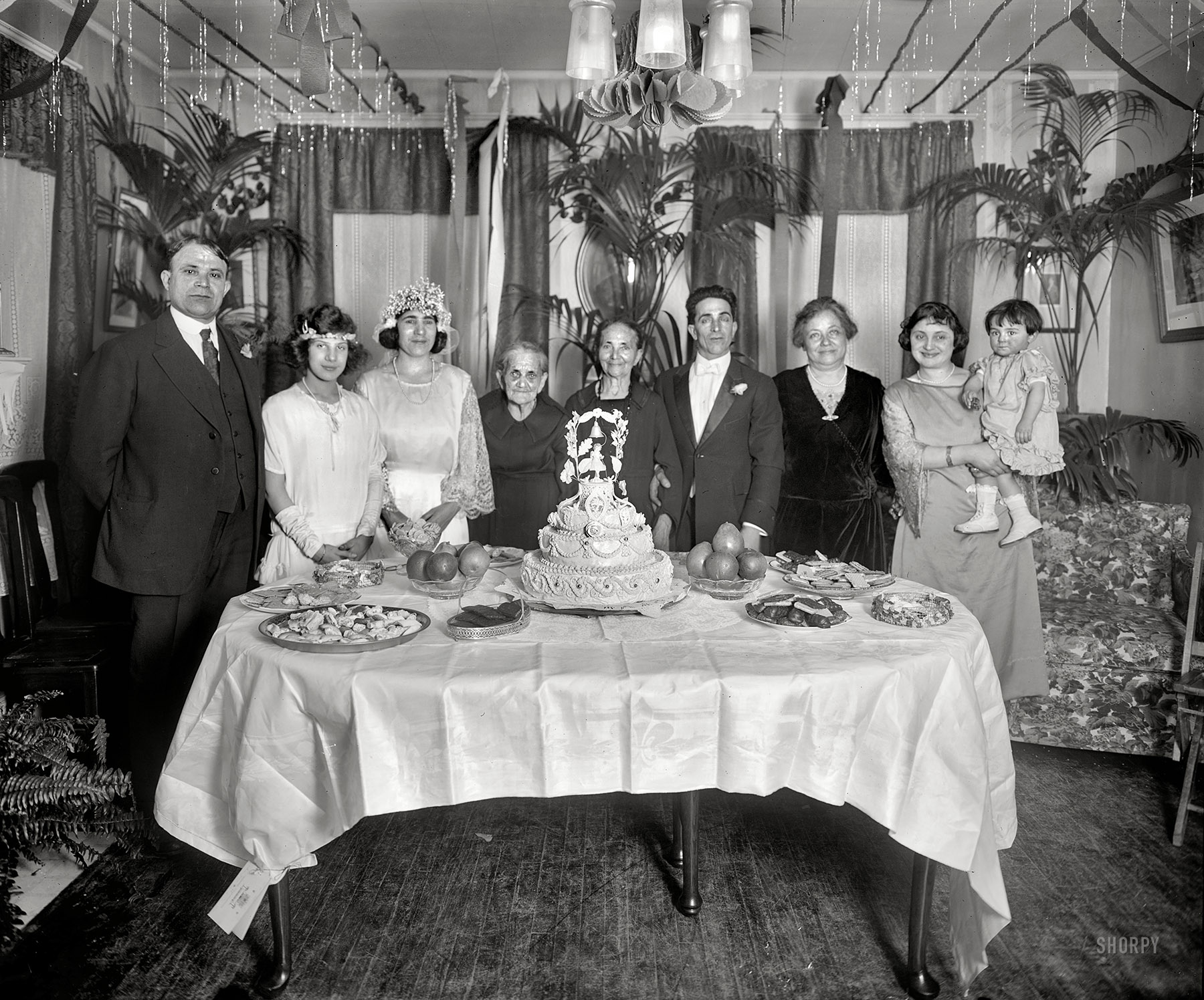 Washington, D.C., circa 1921. "Scalco, National Fruit Co." Salvatore Scalco, the groom and company president, was last seen here three years ago. Now posing with the older generation. National Photo glass negative. View full size.