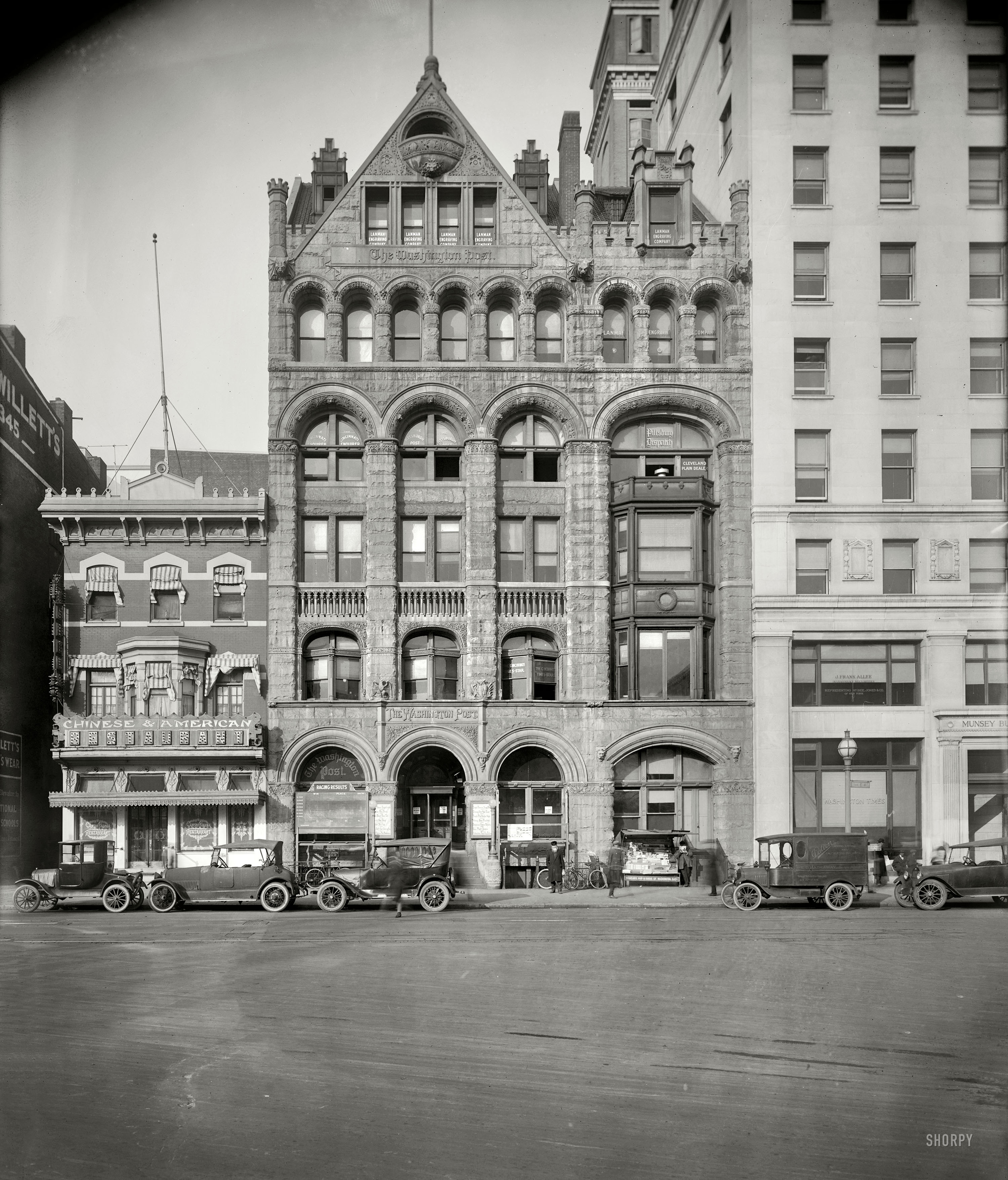 Washington, D.C., circa 1921. "Washington Post building, 1339 E Street." Neighbors are the Washington Times in the much bigger Munsey Trust Building, and a Chinese restaurant ("Canton Pagoda") to the left. Out front, signs with the day's headlines as well as racing results, and a Dalton "Adding/Listing and Calculating Machines" truck. National Photo Co. glass negative. View full size.