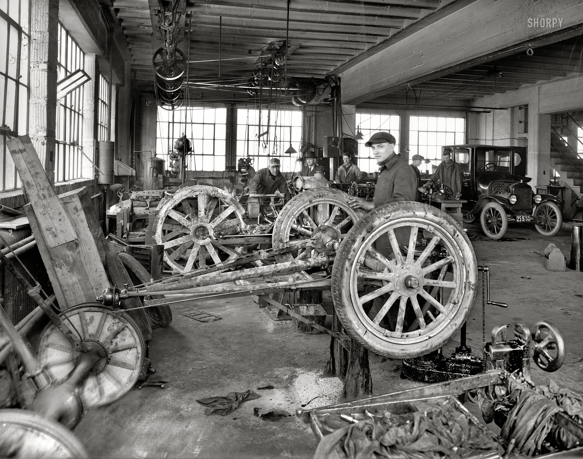 1923. "R.L. Taylor Motor Co." The service garage of this Washington, D.C., Ford dealer, seen earlier here. Here we are 20 years into the Motor Age yet this still has the look of your local Conestoga wagon repair shop. View full size.
