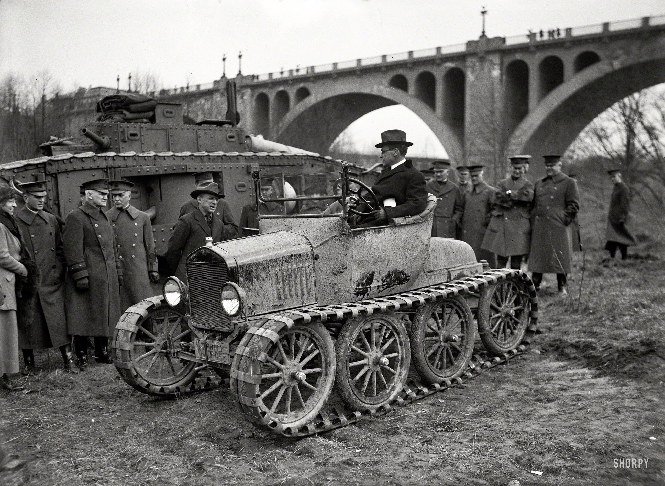 &nbsp; &nbsp; &nbsp; &nbsp; "Secretary of War Newton D. Baker trying out a new eight-wheel Ford tractor, which has the reputation of being able to get over almost any road. Among the dignitaries in the background is Maj. Gen. Peyton C. March." Click here for another view.
February 1921. Washington, D.C. "Army car at Connecticut Avenue Bridge." A sort of Model T on steroids. Harris & Ewing Collection glass negative. View full size.