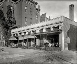 Washington, D.C., circa 1922. "Lotos Lantern." Miss Steger's tea house at 731 13th Street. National Photo Company Collection glass negative. View full size.
Original automobile &quot;blue book&quot;The "Automobile Blue Book" sign on the corner of the building brings up a very dim memory of seeing these (and maybe actively looking for them?) when I was a kid. Does anyone know when that publication finally ceased? A great many of them are online at Google Books for free - fascinating reading - but I couldn't find their history with anything I searched for.
Special Attention to MotoristsDon't know the answer to jwp's question but below is the advertisement for Lotos Lantern Tea House in the 1923 edition of the Automobile Blue Book.
Previous Shorpy post, The Lotos Lantern: 1916, shows this building from another angle as well as the prior, much smaller, location of the tea house around the corner.
[Note to Dave: 13th 17th street.]
(The Gallery, D.C., Eateries & Bars)